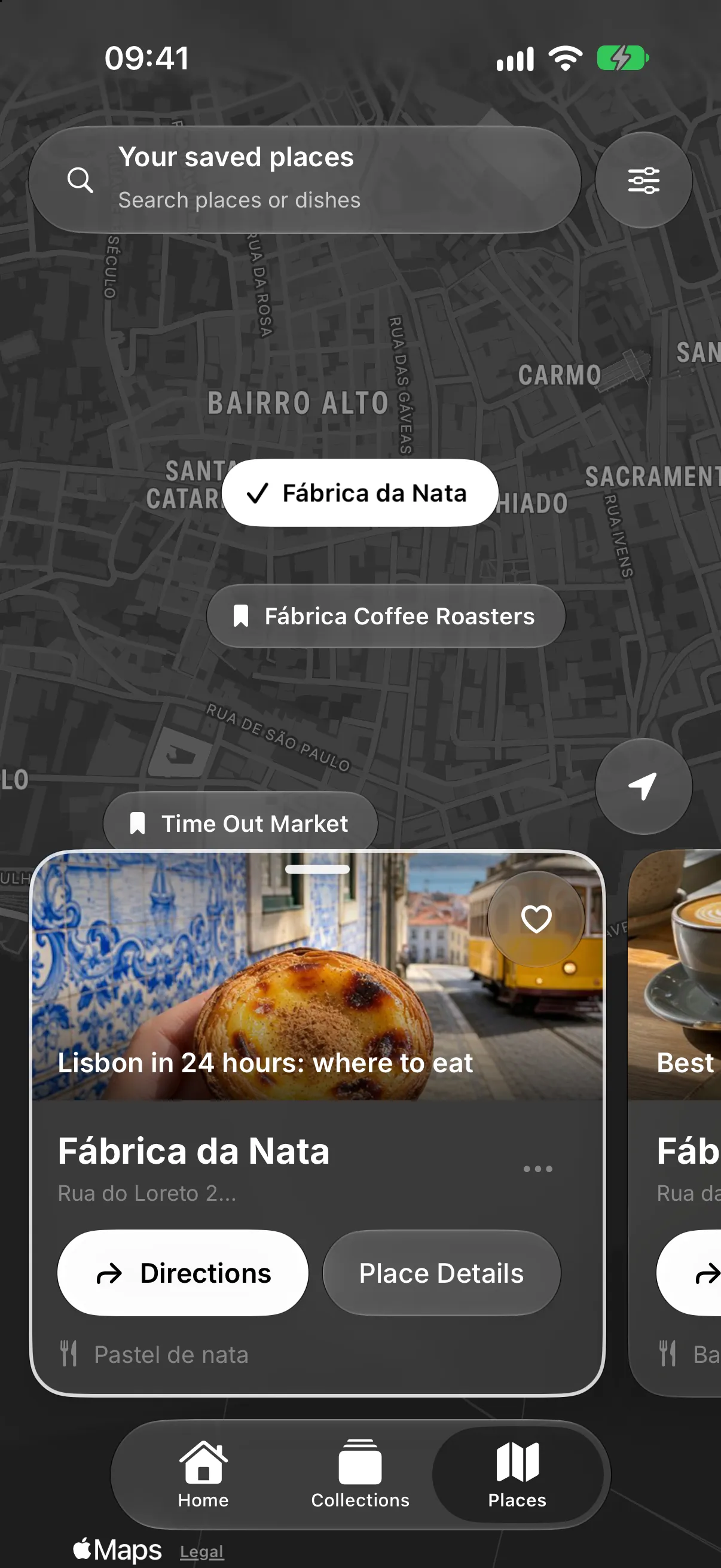 A man on a steep street in Lisbon looking for a café on his phone, next to a Smoosh map of saved places